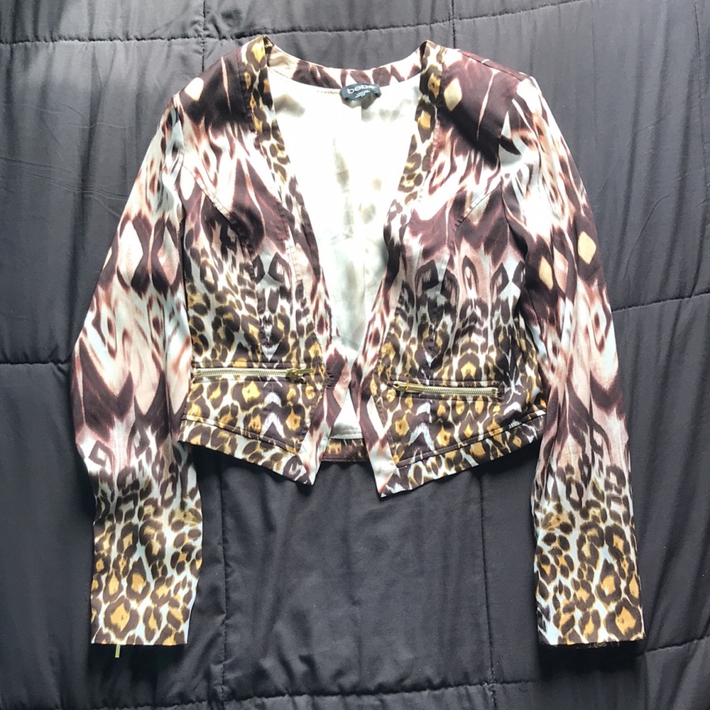 BEBE leopard print thin MED tuxedo jacket with working zippers/clasp.Used Once
